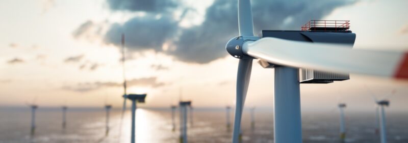 offshore-wind-power-and-energy-farm-with-many-wind-turbines-on-the-picture-id1271332416