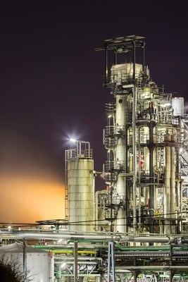 refinery-towers-and-steam-at-night