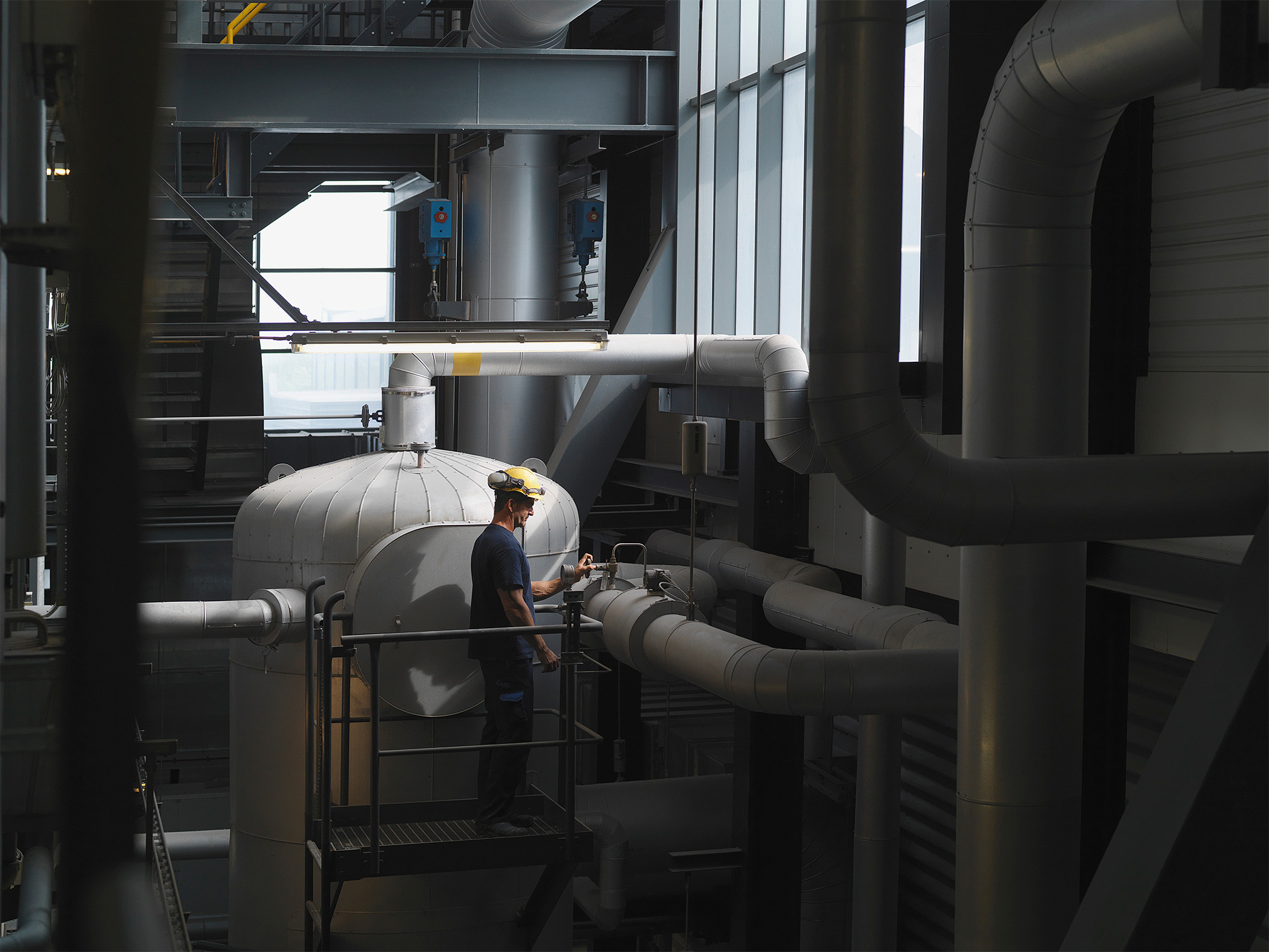 worker-operating-machinery-in-factory