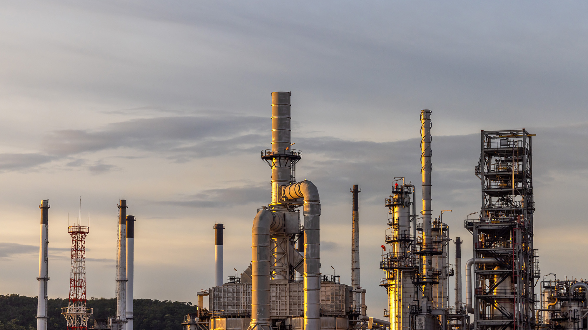 oil-refinery-silhouetted-against-the-sunset-sky-2026-09-23-22-25-44-utc